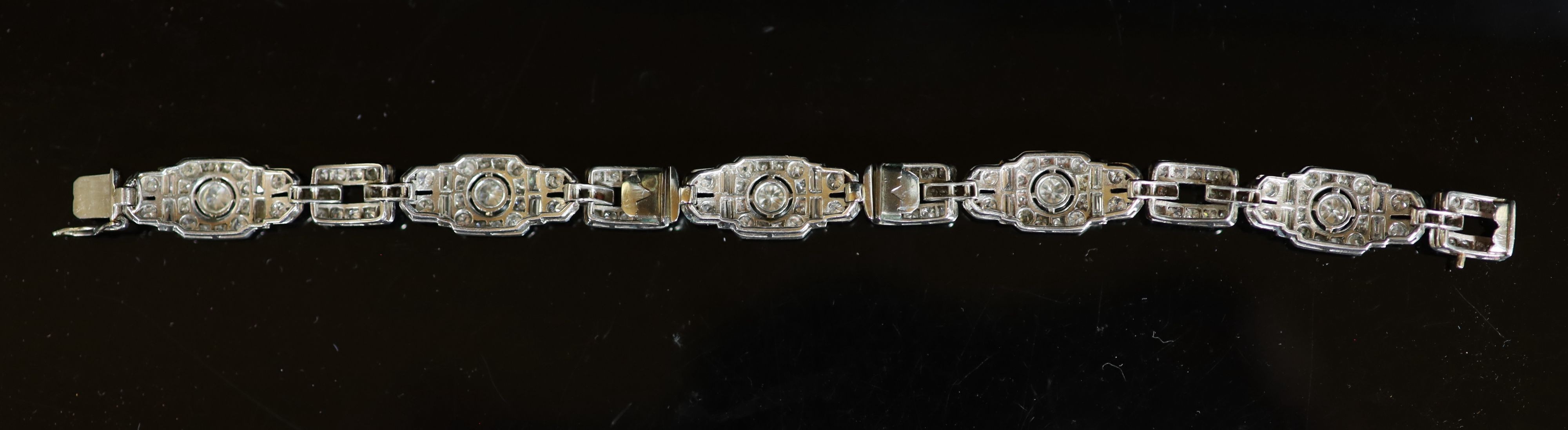 A mid 20th century platinum and diamond encrusted rectangular link bracelet